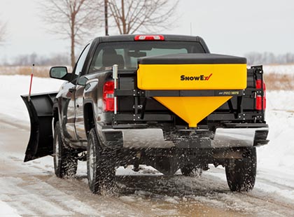 salt spreader attached to tailgate of truck